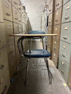 image of a blue chair/desk combo