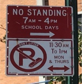 No standing school days parking sign and street cleaning parking sign